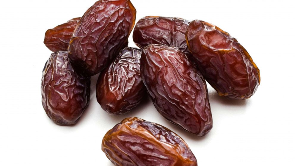 PHOTO: Date fruit on a white background.