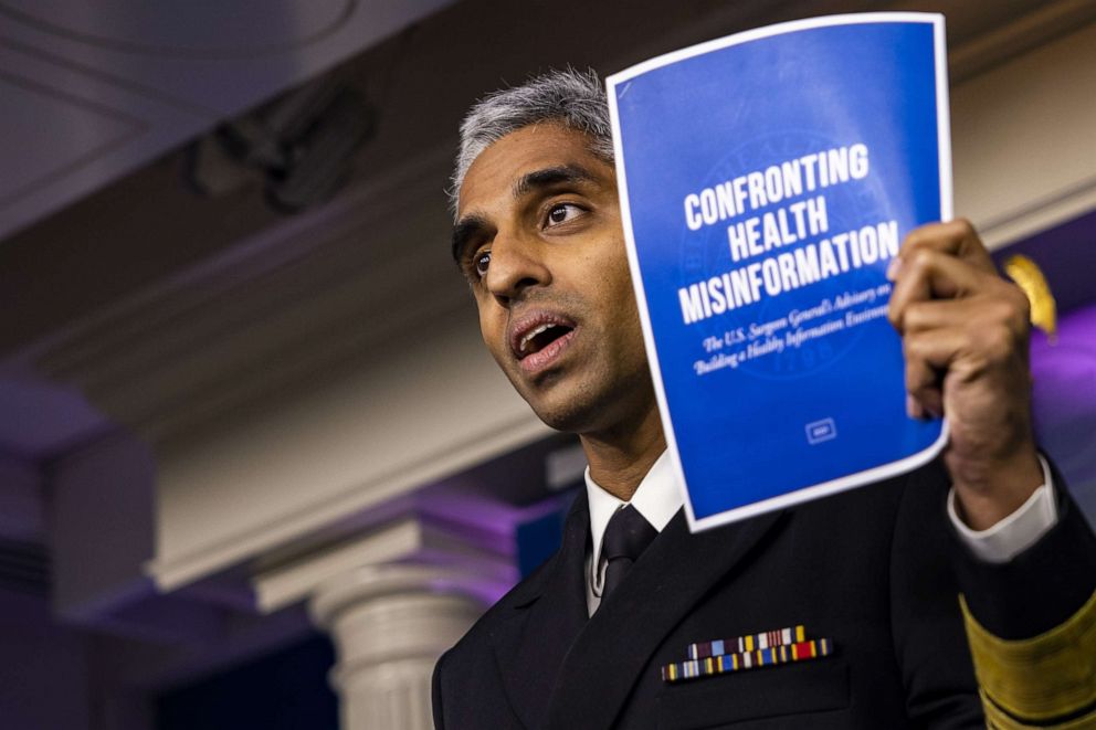 PHOTO: Vivek Murthy, U.S. surgeon general, displays a leaflet titles "Confronting Health Misinformation as he speaks during a news conference  in Washington, July 15, 2021.