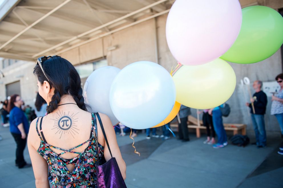 PHOTO: A woman displays her pi tattoo during a Pi Day Celebration at the Exploratorium in San Francisco, Thursday, March 14, 2019.