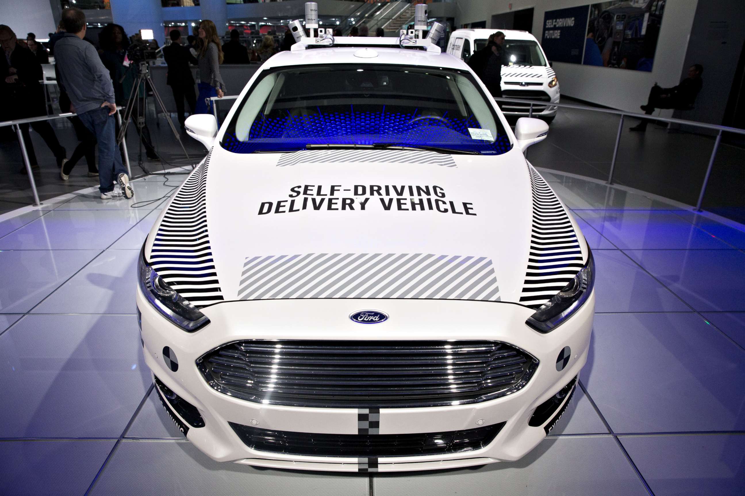 PHOTO: A Ford Motor Co. Fusion set-up as an experimental self-driving delivery vehicle sits on display during the 2018 North American International Auto Show (NAIAS) in Detroit, Michigan, Jan. 15, 2018.