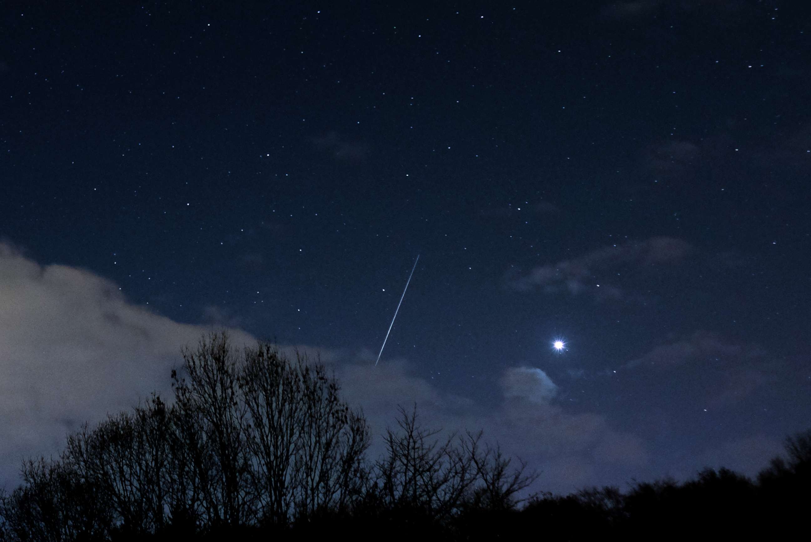 PHOTO: A meteor from the Geminid Meteor shower streaks across the night sky, Dec. 14, 2018, in Saltburn By The Sea, United Kingdom.