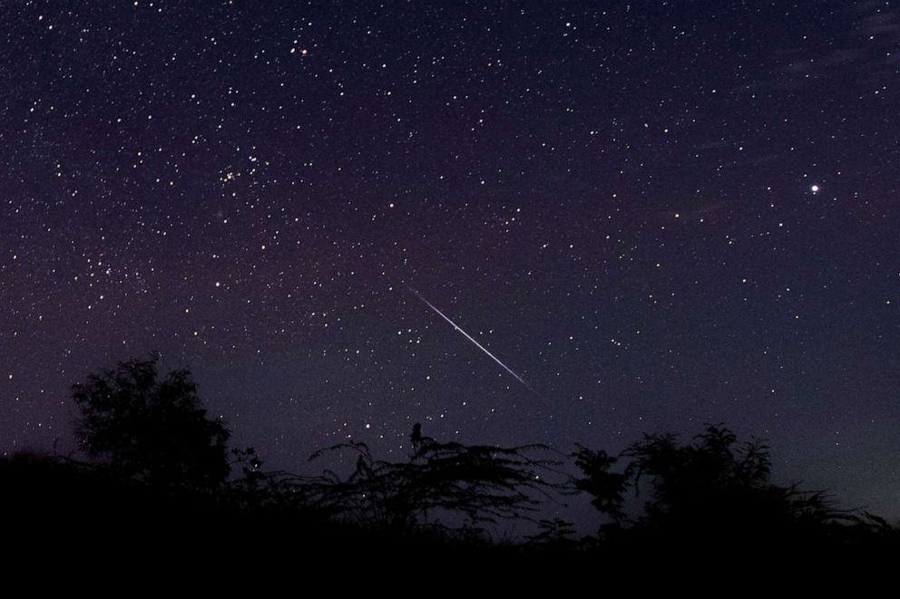 PHOTO: A meteor streaks through the night sky over Myanmar during the Geminid meteor shower, Dec. 14, 2018.