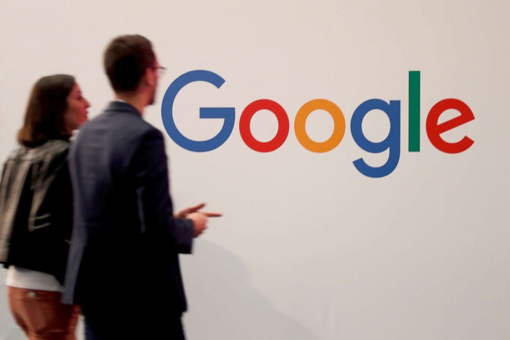 PHOTO: Visitors pass by the logo of Google at the annual technology conference VivaTech in Paris, France, on May 16, 2019.