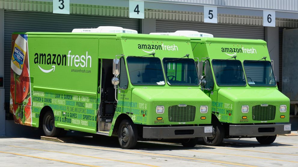 Amazon Fresh trucks sit parked at a warehouse in Inglewood, Calif., June 27, 2013.
