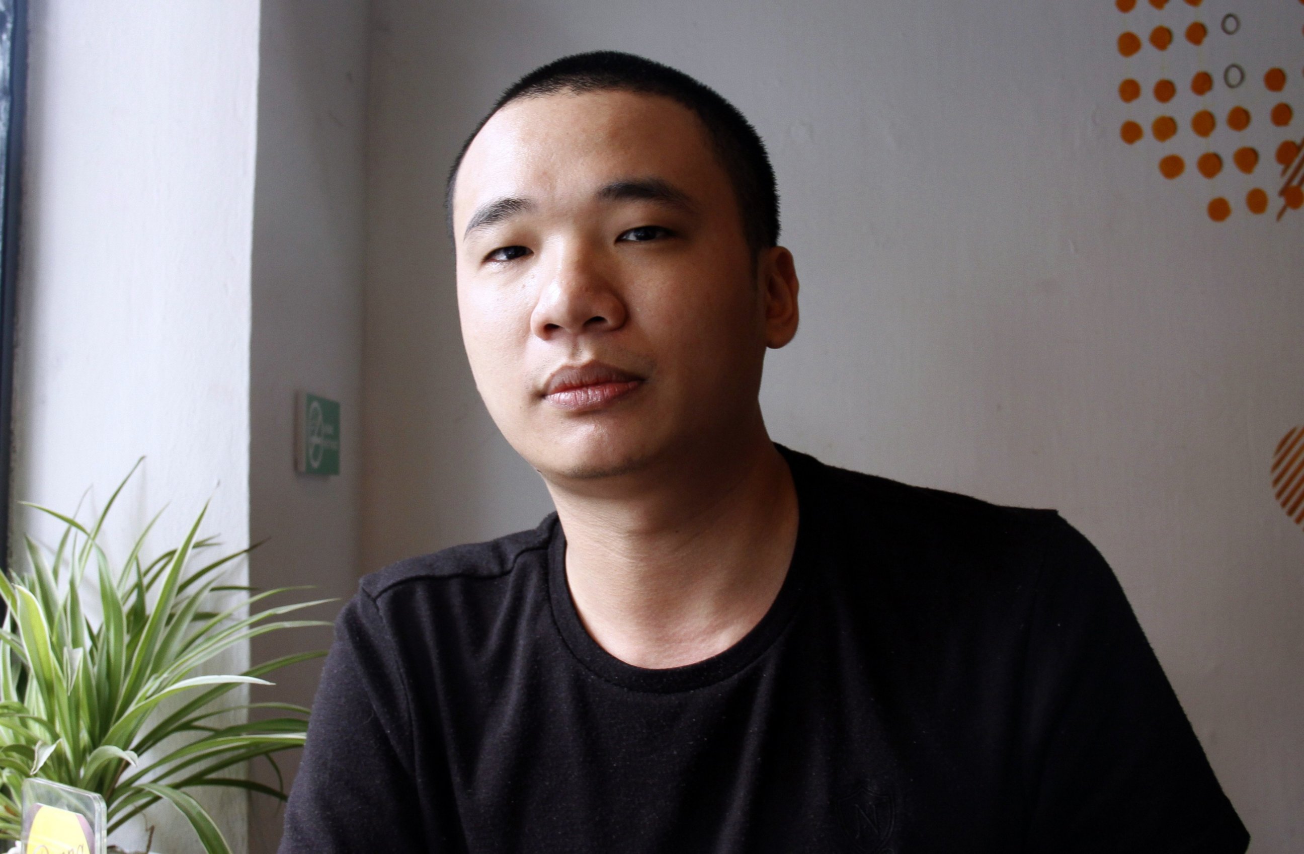 PHOTO: This picture taken on Feb. 5, 2014 shows Nguyen Ha Dong, the author of the game Flappy Bird relaxing inside a coffee shop in Hanoi.  