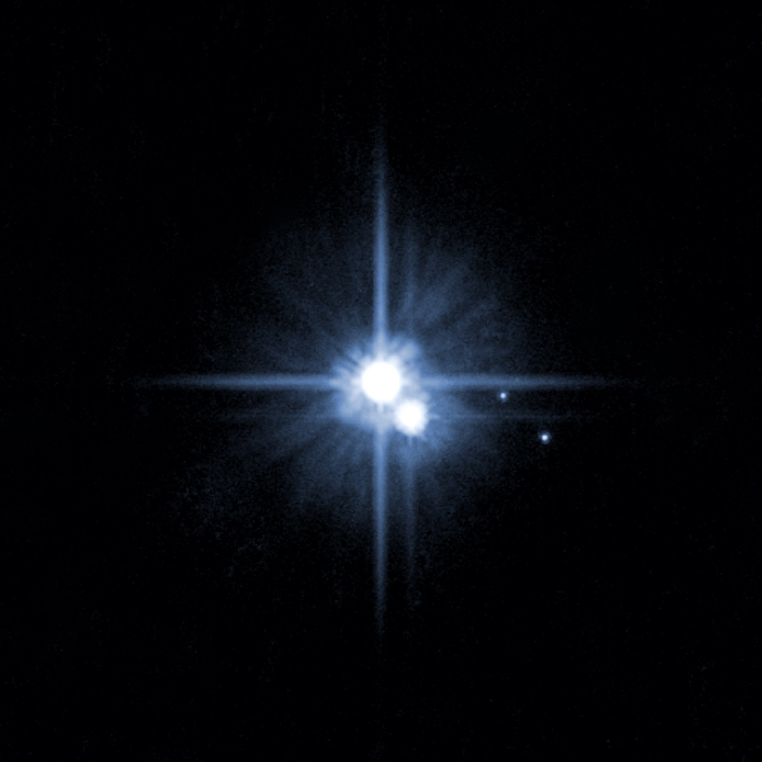 PHOTO: A Hubble Space Telescope image released by NASA in 2006 shows Pluto and three of it's five moons.