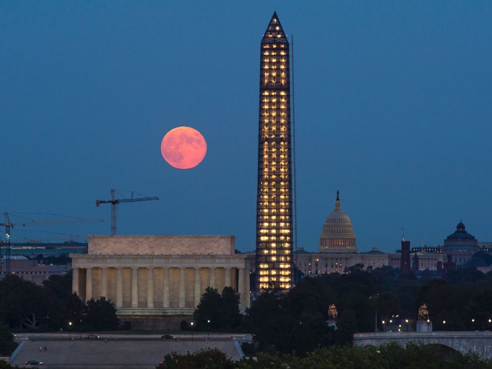 PHOTO: In this handout photo by the National Aeronautics and Space Administration, a full moon, or Harvest Moon, rises over the Lincoln Memorial, the Capitol building and the under-repair Washington Monument on Sept. 19, 2013 in Washington, DC.