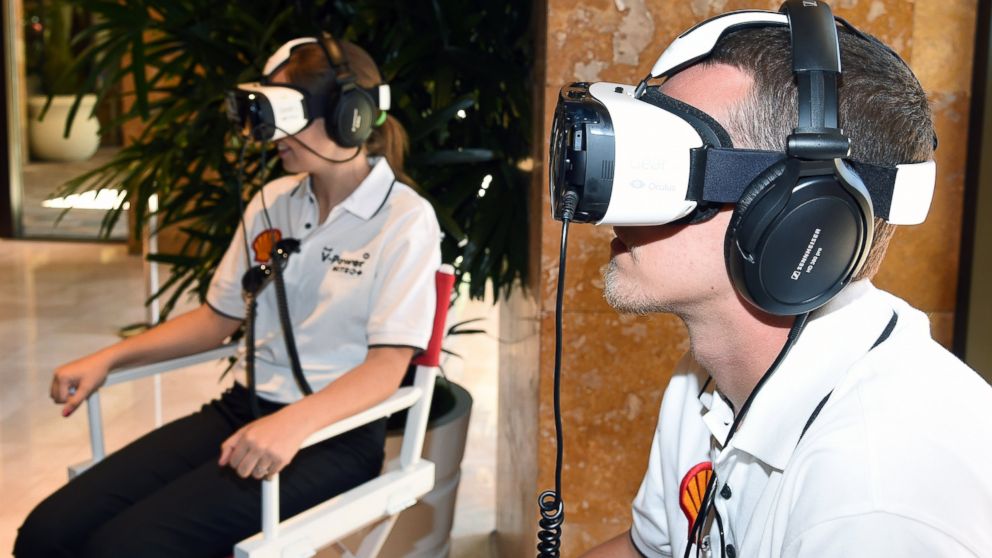 Lydia Penn and Andrew Penn take a 3D engine journey with the Oculus Rift-powered Gear VR headset on June 8, 2015 in Las Vegas, Nev.  