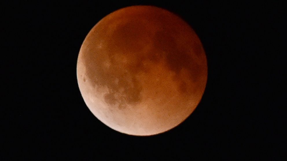 The moon turns a reddish color in the earth's shadow during a total lunar eclipse, April 15, 2014 as seen from Magdalena, New Mexico.