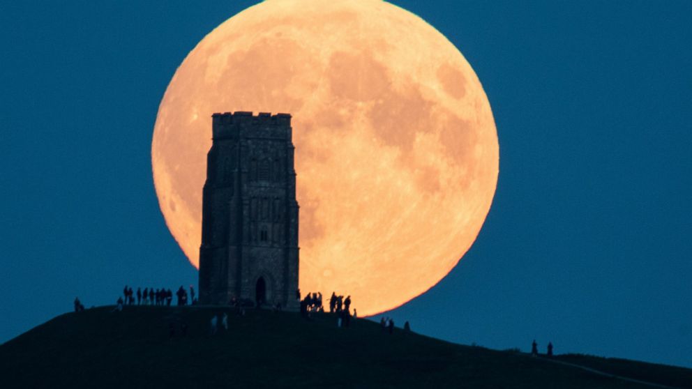 PHOTO: The supermoon rises behind Glastonbury Tor on September 28, 2015 in Somerset, England.