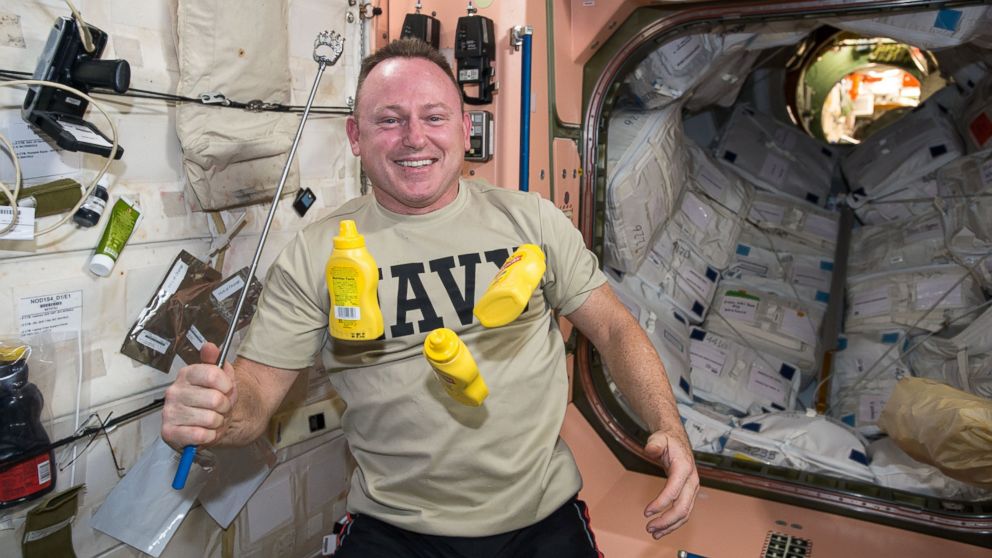 PHOTO: U.S. astronaut Barry Wilmore, the Commander on the International Space Station, juggles mustard bottles in microgravity on Jan. 15, 2015.