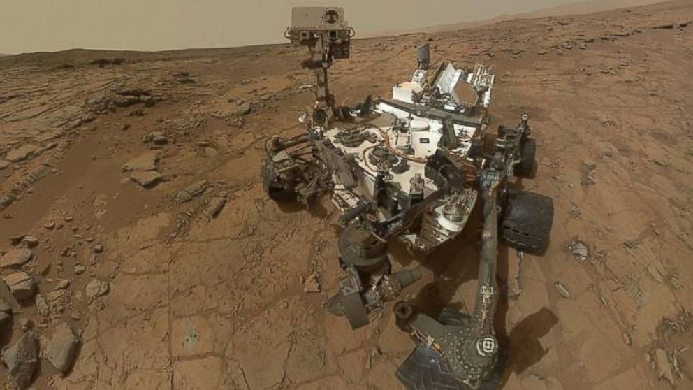 This self-portrait of NASA's Mars rover Curiosity combines dozens of exposures taken by the rover's Mars Hand Lens Imager on Feb. 3, 2013 plus three exposures taken May 10, 2013 to show two holes, in lower left quadrant, where Curiosity used its drill on the rock target "John Klein."