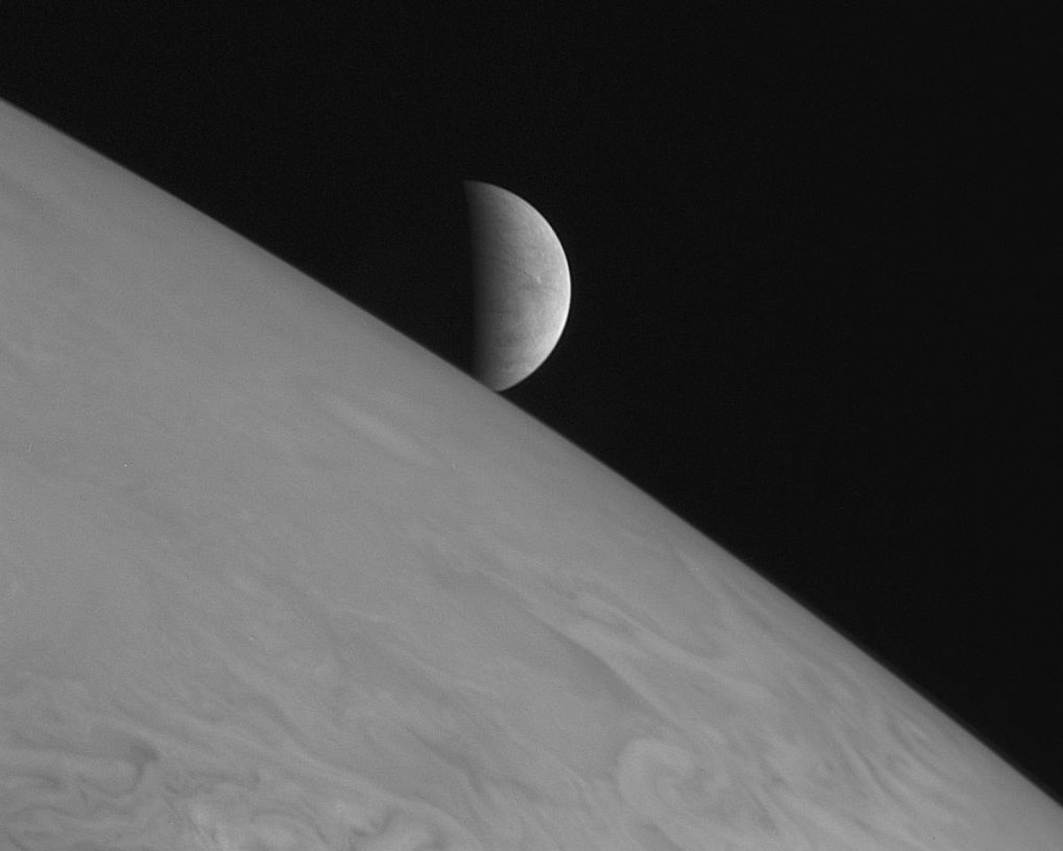 PHOTO: New Horizons took this image of the icy moon Europa rising above Jupiter's cloud tops with its Long Range Reconnaissance Imager (LORRI)on Feb. 28, 2007.