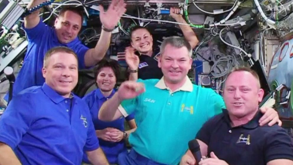 Commander Barry Wilmore hands over command of the International Space Station to Terry Virts.
