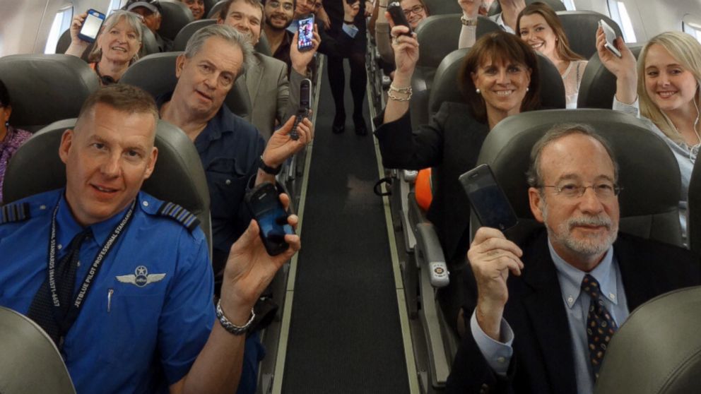 Passengers on JetBlue Flight 2302, the first flight to allow use of electronic devices during takeoff and landing. 