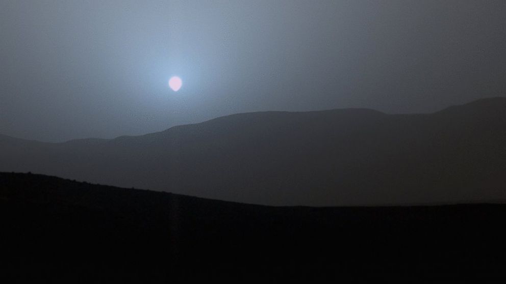 NASA's Curiosity Mars rover recorded this image of the sun setting at the close of the mission's 956th Martian day, or sol, April 15, 2015, from the rover's location in Gale Crater.