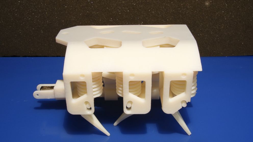This 3-D hexapod robot moves via a single motor, which spins a crankshaft that pumps fluid to the robot’s legs. Besides the motor and battery, every component is printed in a single step with no assembly required.
