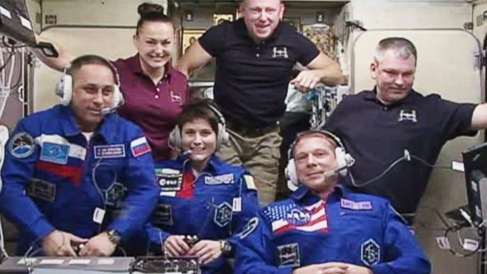 The six International Space Station crew members of Expedition 42, seen during a greeting ceremony on Nov. 24, 2014, will enjoy a Thanksgiving meal that includes irradiated smoked turkey, freeze-dried cornbread dressing and thermostabilized cherry-blueberry cobbler.
