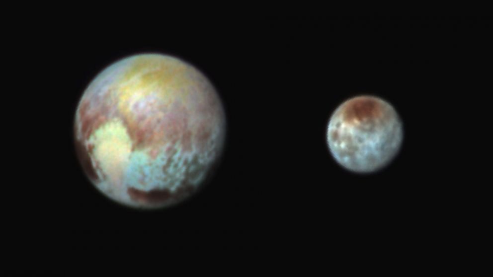 PHOTO: This July 13, 2015, image of Pluto and Charon is presented in false colors to make differences in surface material and features easy to see. 