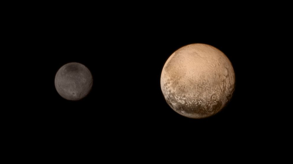 A portrait from the final approach. Pluto and Charon display striking color and brightness contrast in this composite image from July 11, 2015 showing high-resolution black-and-white LORRI images.