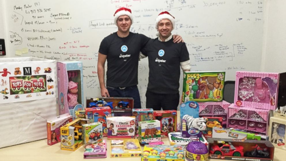 Shipster CEO Christian Vizcaino and co-founder Thomas Maher pose with donated toys.