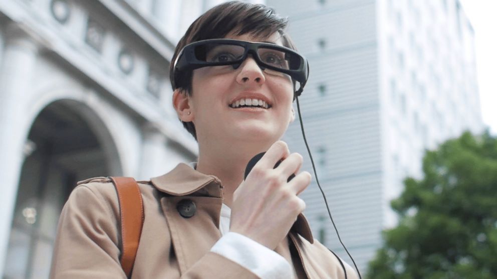 A person is pictured wearing Sony's SmartEyeglass in this image. 