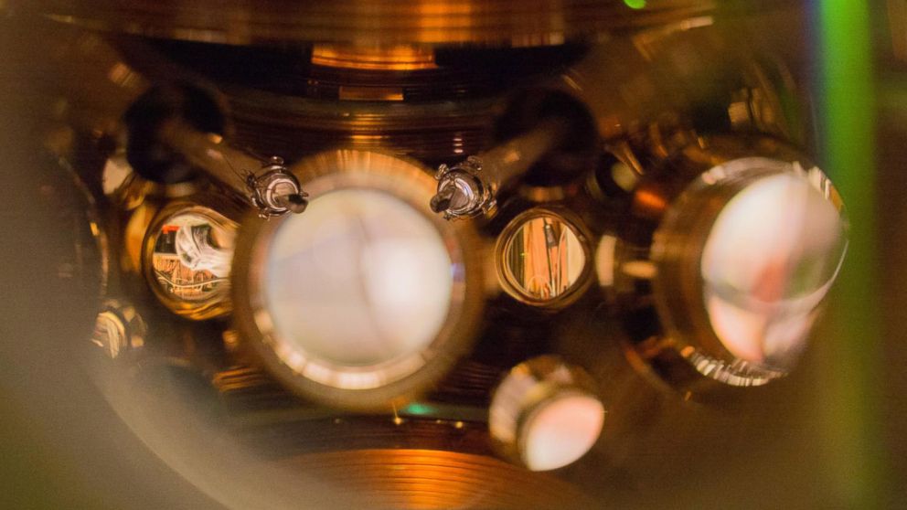 JILA's strontium lattice atomic clock now performs better than ever because scientists literally take the temperature of the atoms' environment with specialized thermometers visible in the center of the photo.