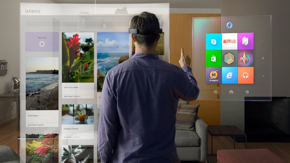 PHOTO: A handout image from Microsoft released on Jan. 21, 2014 shows a mock-up of the interface of the new HoloLens goggles that allows users to interact with applications through gesture and voice commands.