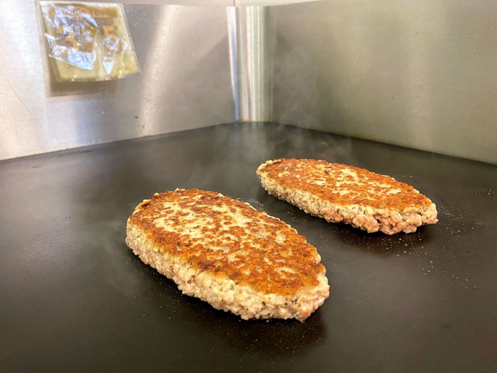 PHOTO: A plant-based Impossible Pork patty is cooked at the Impossible Foods headquarters in Silicon Valley, in San Francisco, Dec. 19, 2019.