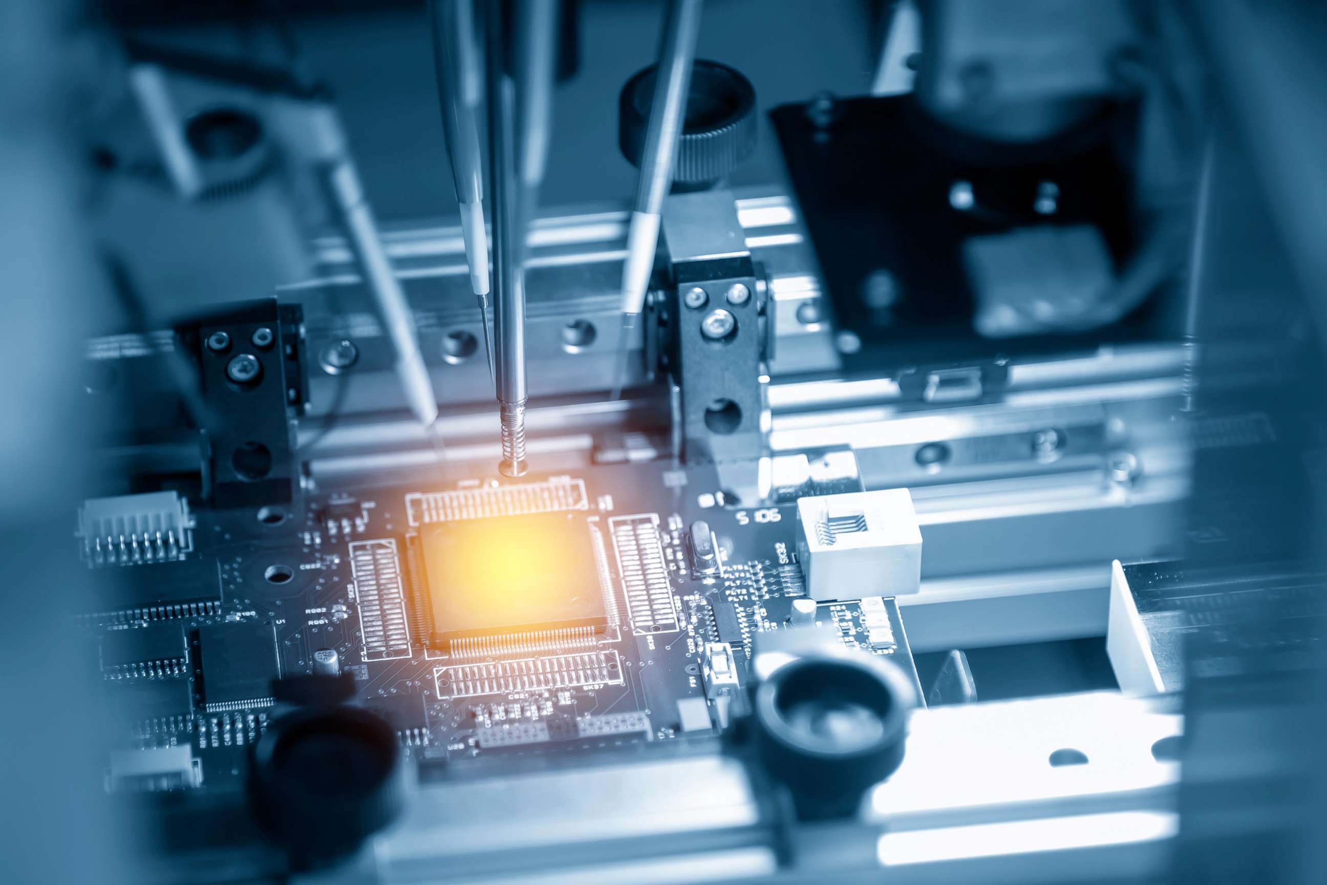 PHOTO: A microchip is illuminated on the main board in the assembly line in an undated stock image.