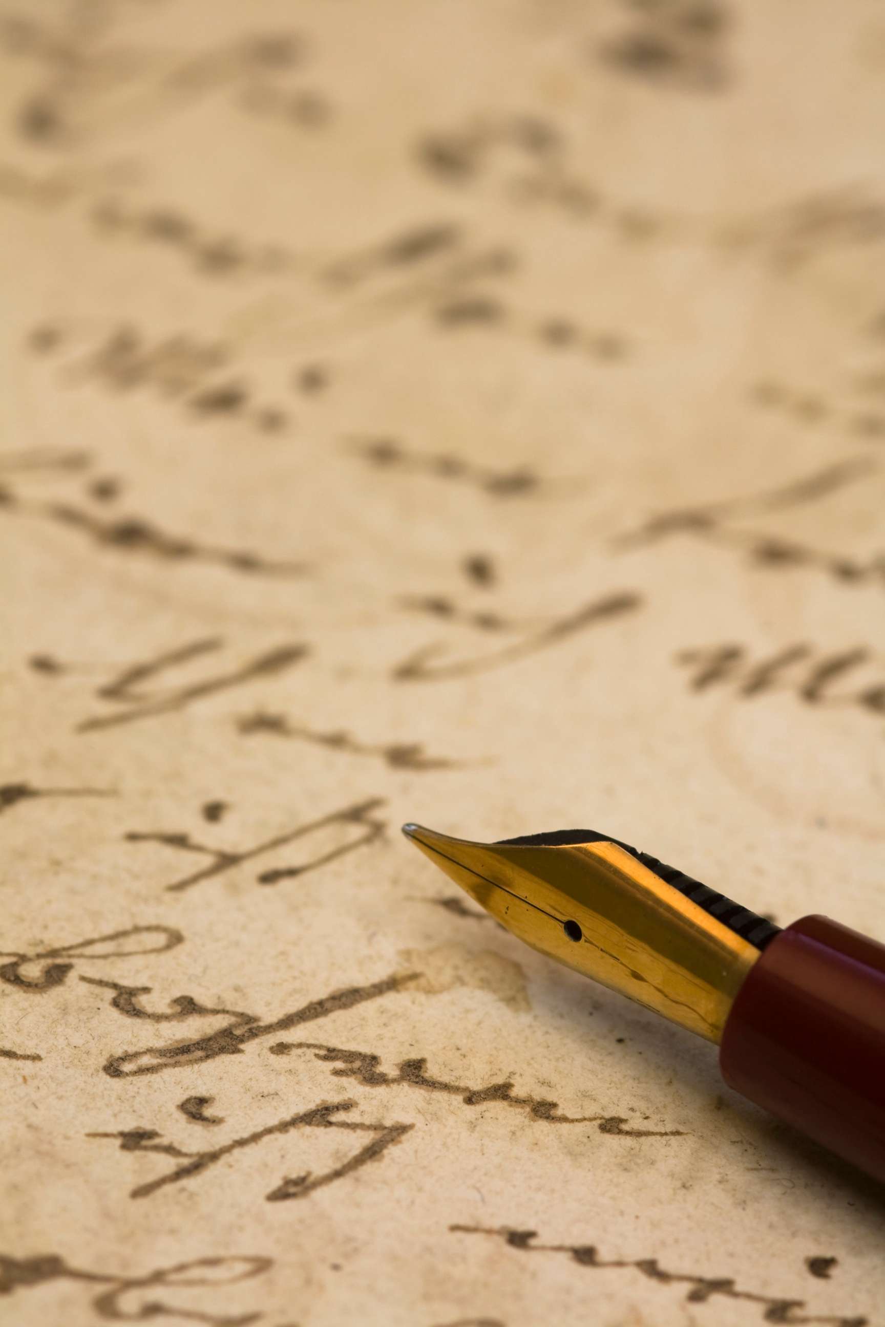 PHOTO: Stock photo of a fountain pen and an old hand written letter.