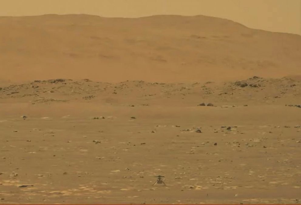 PHOTO: NASA's experimental Mars helicopter Ingenuity lands on the surface of Mars, April 19, 2021.