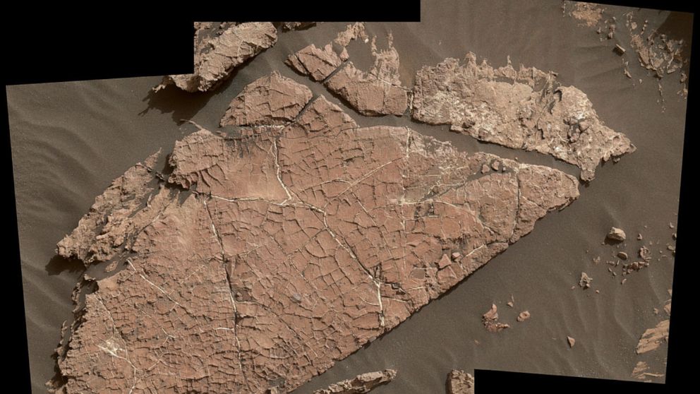 PHOTO: The network of cracks in this Martian rock slab called "Old Soaker" may have formed from the drying of a mud layer more than 3 billion years ago.