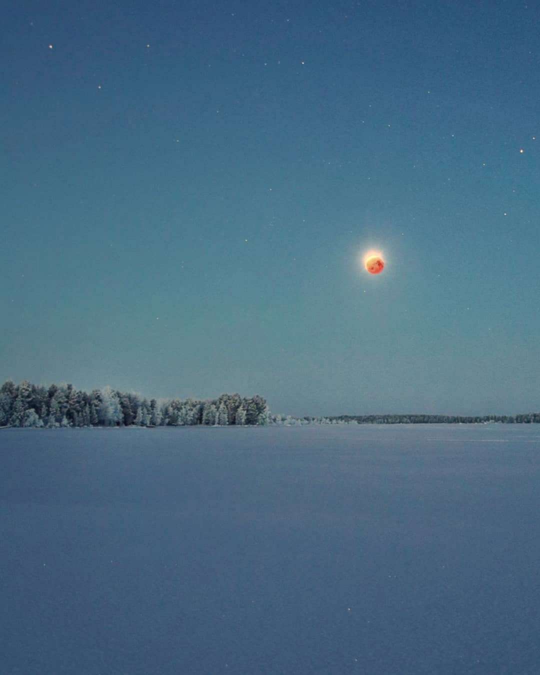 PHOTO: Hannahbel Nel captured this image of the moon during the eclipse over a frozen lake from Lapland.