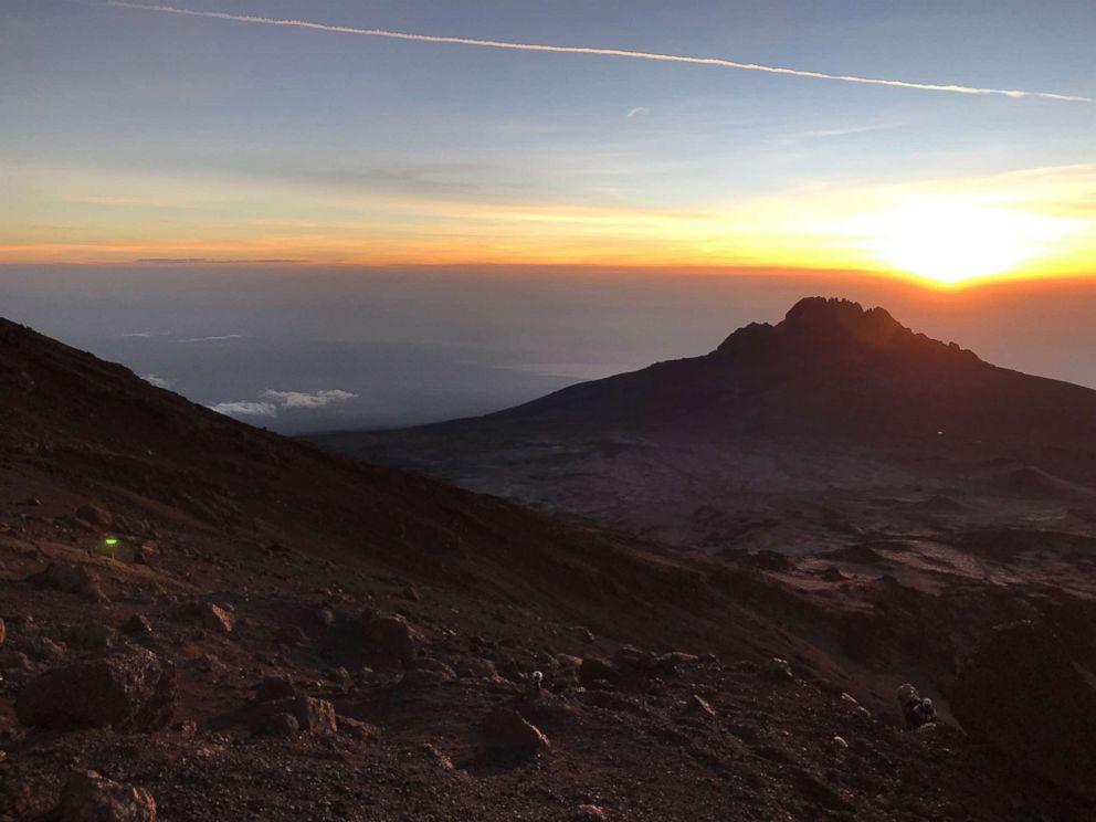 PHOTO: Sunrise is pictured from Gilman's Point at an elevation of 5685 meters, just below the crater at the summit of Mount Kilimanjaro, Tanzania, in February 2019.