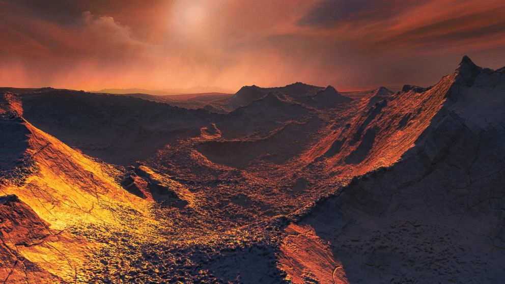 PHOTO: An illustration shows the frozen surface of a newly discovered exoplanet at least 3.2 times as large as the Earth rotating Barnard's Star, the closest single star to the Sun.