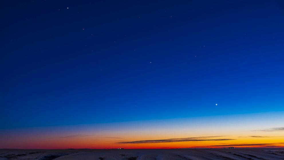 PHOTO: The line-up of three evening planets in the southwest twilight sky, on Dec. 17, 2021, with Jupiter at top left, Venus at bottom right, and dimmer Saturn in the middle, all defining the line of the ecliptic in the cold winter sky this night. 