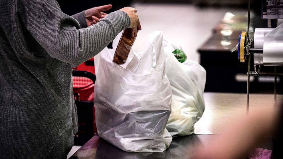 PHOTO: In this picture taken on Nov. 7, 2018, a woman packs her shopping into a plastic bag in a supermarket in Chiba, Japan.