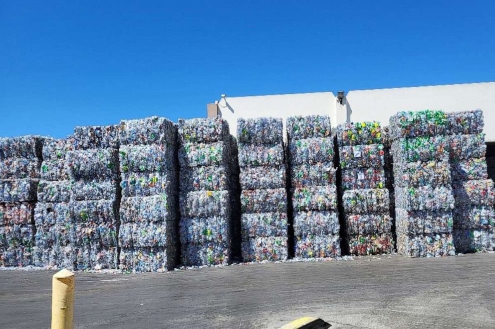 PHOTO: Stacks of plastic bottles are seen outside Ming's Recycling.