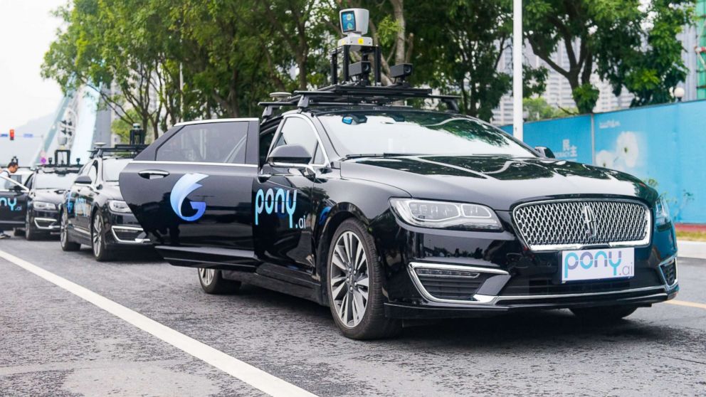 PHOTO: Pony.ai self-driving cars run along a road during a trial run, Feb. 2, 2018, in Guangzhou, China.