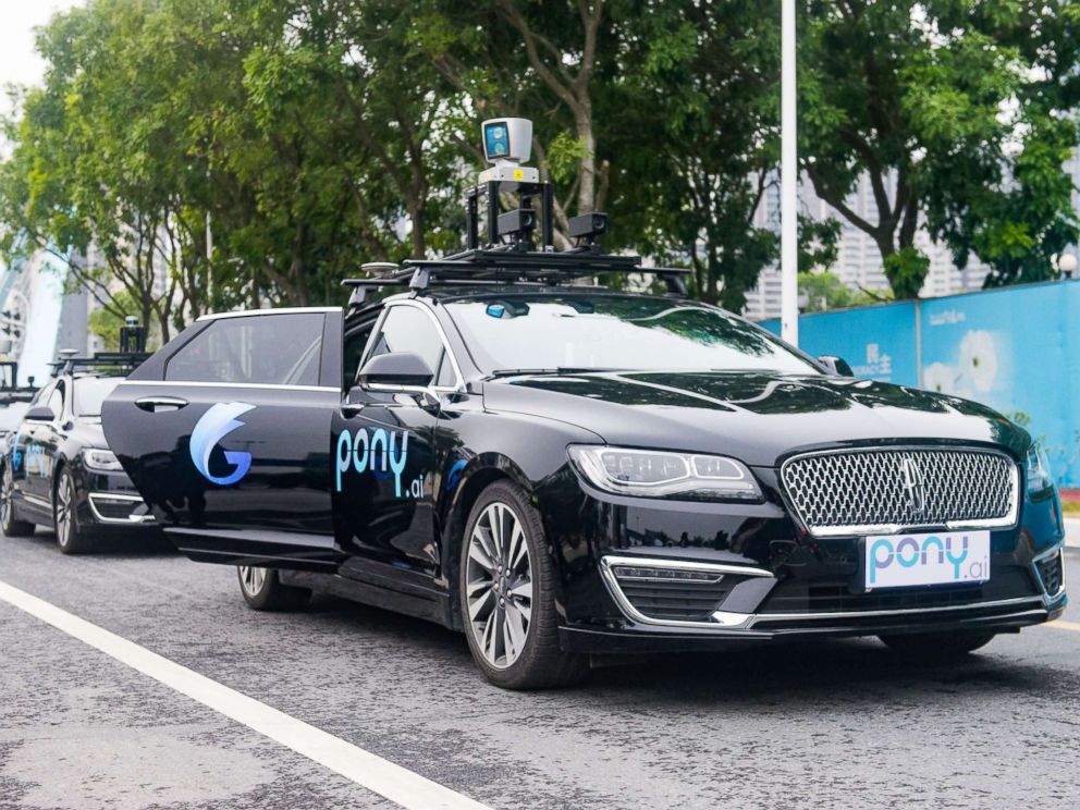 PHOTO: Pony.ai self-driving cars run along a road during a trial run, Feb. 2, 2018, in Guangzhou, China.