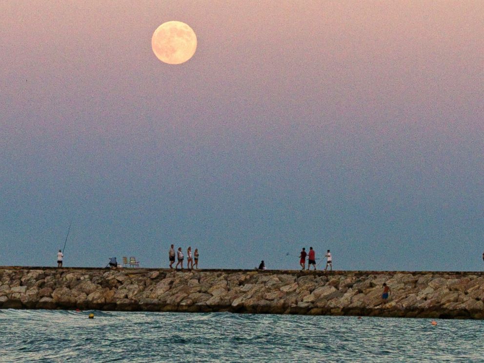 PHOTO: The supermoon rises over the Mediterranean sea at Cabopino beach in southern Spain, August 10, 2014.