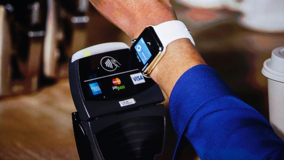 An Apple Watch is shown making a tap transaction during an Apple event at the Flint Center in Cupertino, Calif., Sept. 9, 2014.