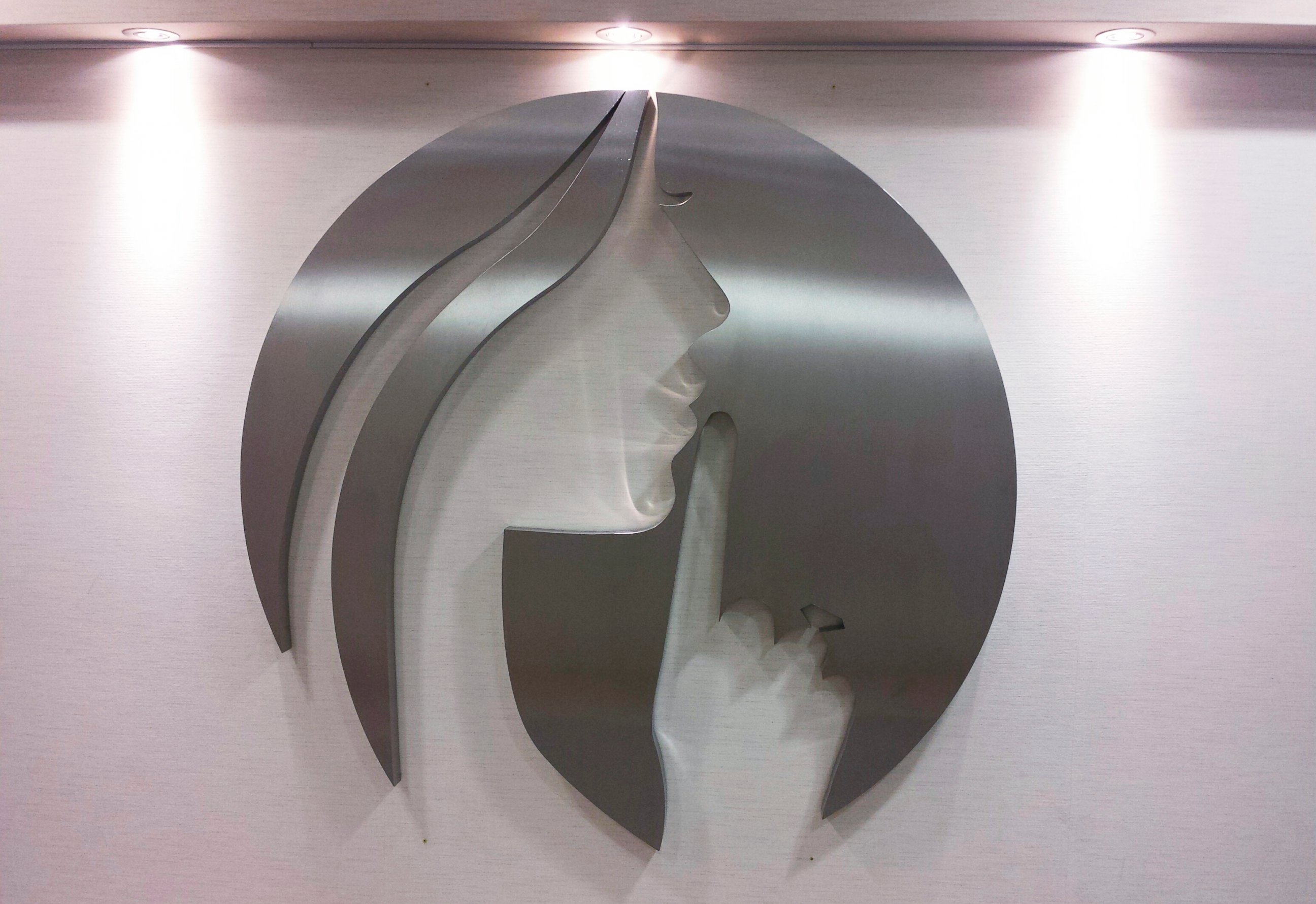 PHOTO: An AshleyMadison.com logo featuring the image of a woman motioning to whisper, is seen at the entry to Avid Life Media's offices in Toronto, July 20, 2015.