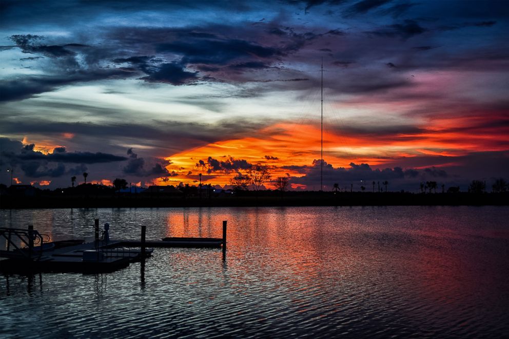 PHOTO: The sun sets over one of the lakes on the Babcock Ranch, a sustainable community, north of Fort Myers, Florida.