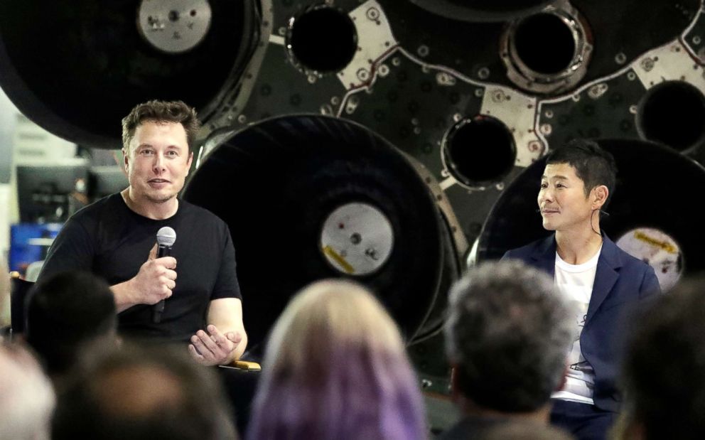 PHOTO: SpaceX founder and chief executive Elon Musk, left, announces Japanese billionaire Yusaku Maezawa, right, as the first private passenger on a trip around the moon, on Sept. 17, 2018, in Hawthorne, Calif.