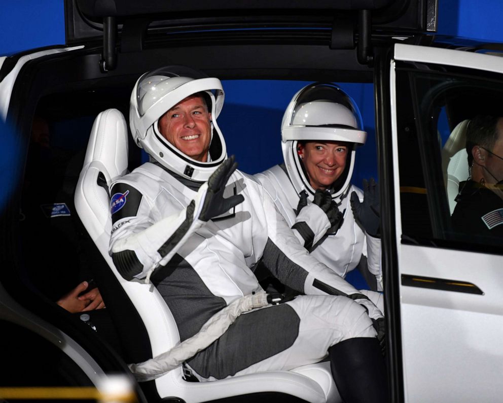 PHOTO: NASA Astronauts Shane Kimbrough and Megan McArthur sit in a Tesla X as they prepare for their ride to Complex 39A at the Kennedy Space Center in Florida, April 23, 2021.