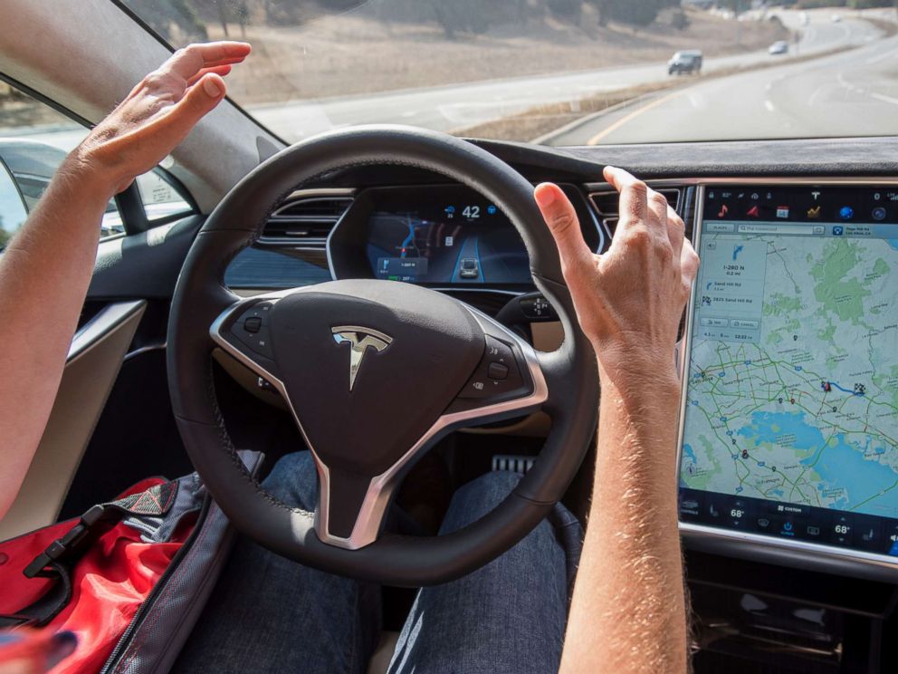PHOTO: In this file photo dated Oct. 14, 2015, a member of the media test drives a Tesla Motors Inc. Model S car equipped with Autopilot in Palo Alto, Calif.