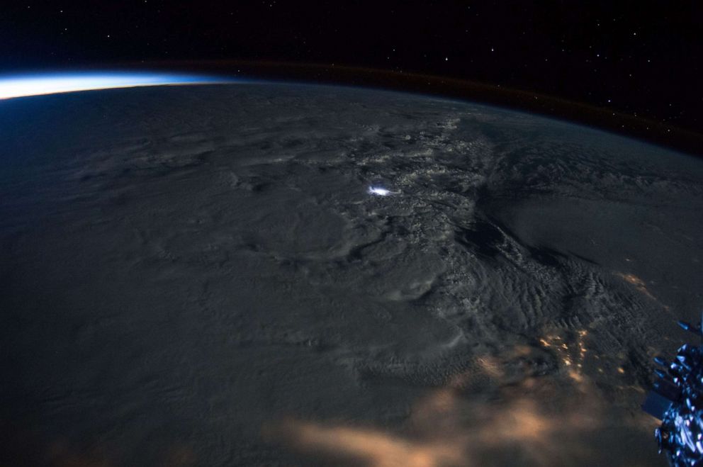PHOTO: In this Jan. 23, 2016, file photo taken by astronaut Scott Kelly on the International Space Station, a rare thundersnow lightning strike is shown during Winter Storm Jonas.