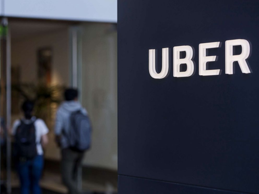 PHOTO: People enter the Uber Technologies Inc. headquarters building in San Francisco, June 21, 2017